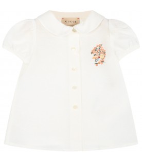 White shirt for baby girl with flowers and logo