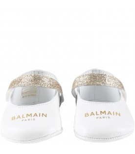 White flats for baby girl with golden logo